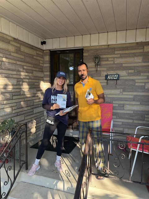 Nicole visiting a resident at their front door