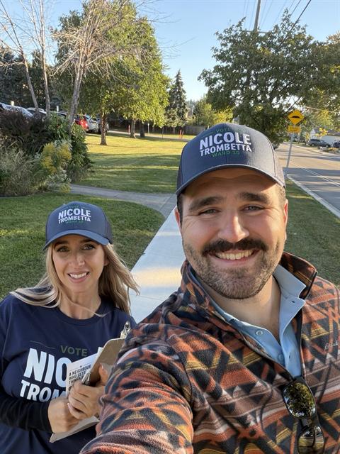 Nicole canvassing with a volunteer